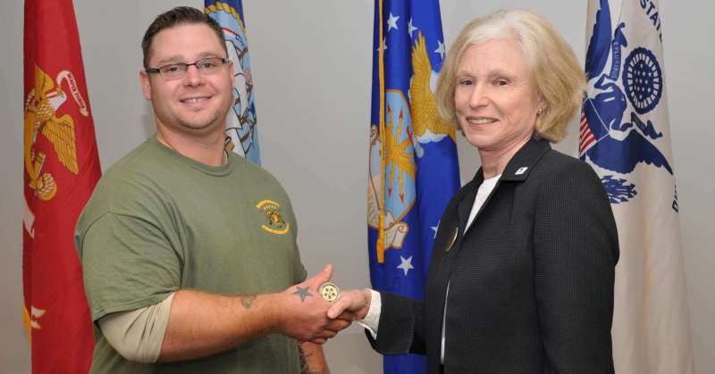 During the Veterans Day ceremony Matt Garman, president of Shepherd’s Student Veterans Organization, presented the 5 Star Challenge coin to Dr. Sylvia Manning, interim president.