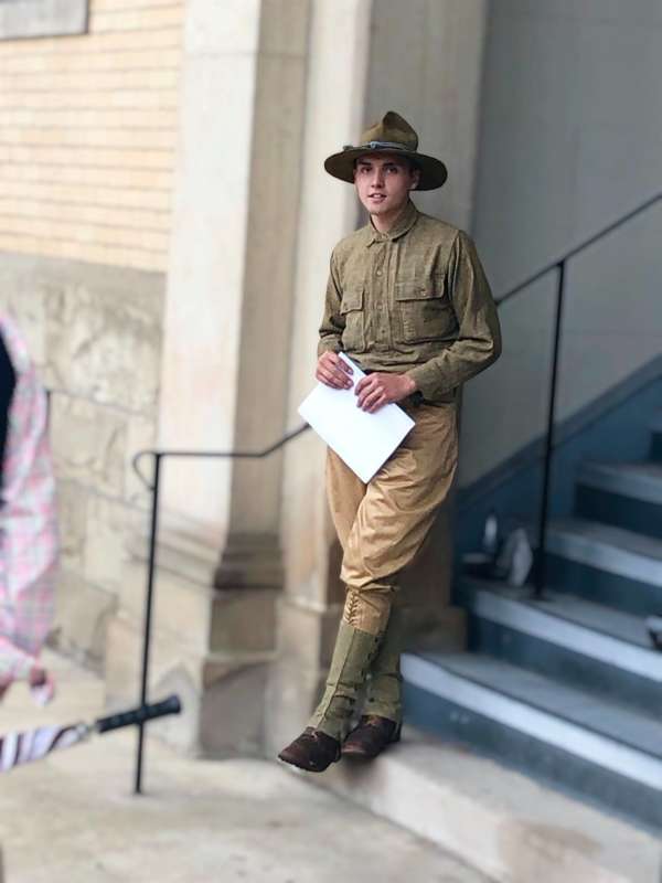 Patrick Fuller, who graduated with a history degree from Shepherd in 2021, spoke to the tour participants in front of Knutti Hall about World War I as it related to the University’s history. In 1918, the senior class chose to erect a memorial plaque on the building’s wall as a monument to the thirteen students who died during service. 