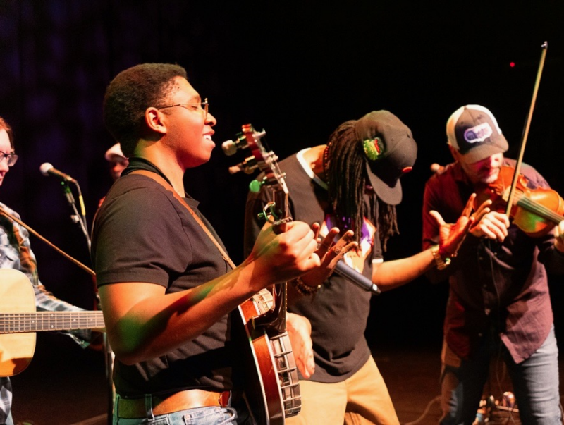 Joshua Jimmerson performing with Gangstagrass on bluegrass banjo