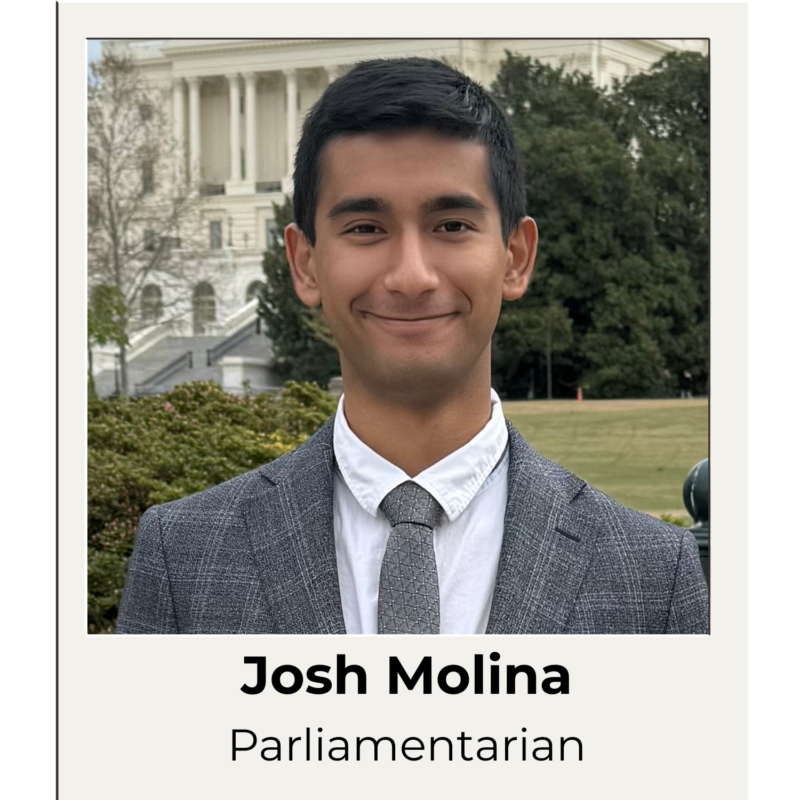 Josh Molina, SGA Parliamentarian headshot - Josh wears a suit and stands in front of the Capitol building in Washington, DC