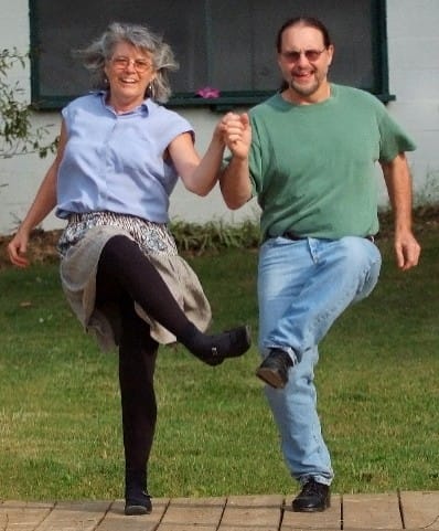 Kim Forry and Jan Scopel flatfoot dancing holding hands in sync