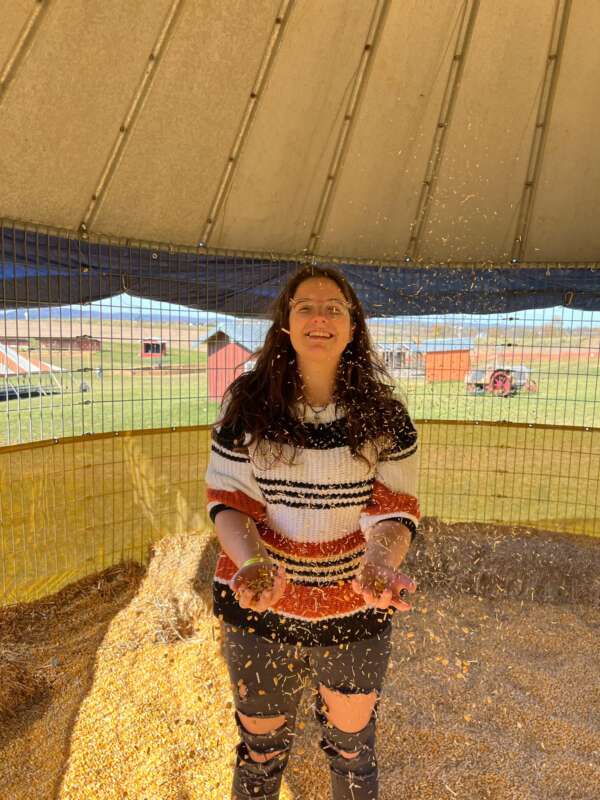Young person standing under a canopy
