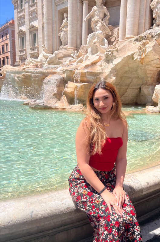 woman sitting in front of water