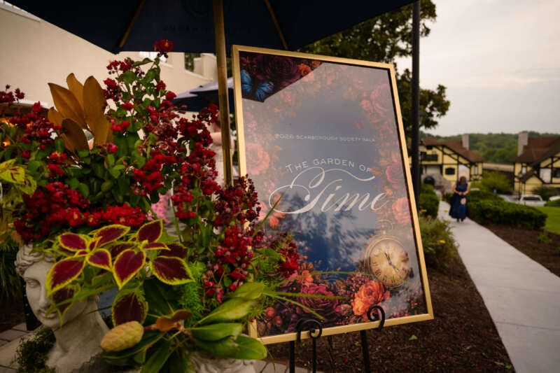 Guests were welcomed to the Bavarian Inn by a “Garden of Time”marquee sign, flanked by stone head planters and flowering plants